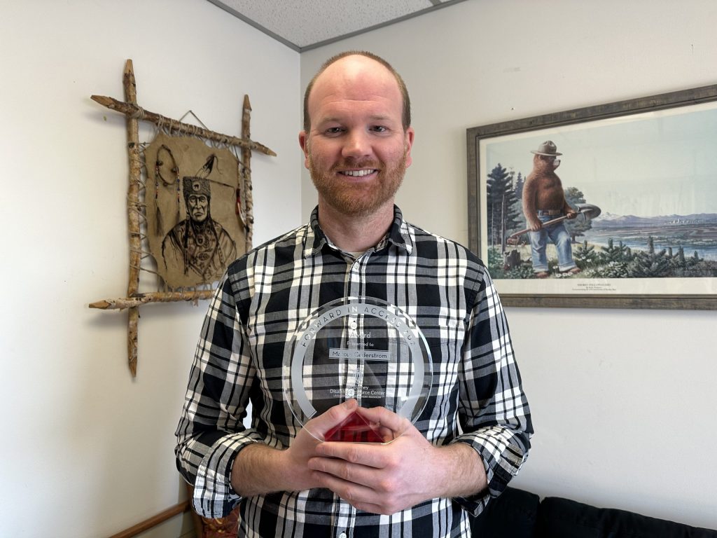 Marcus Cederstrom posing with his access award