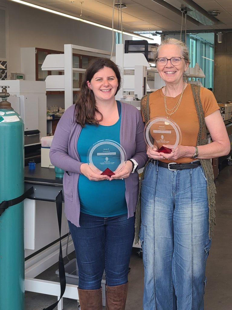 Dr. Amanda Buchberger Jones & Dr. Pam Doolittle with Forward in Access award in a chemistry lab